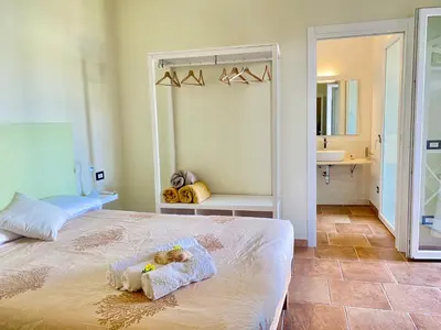Letto o letti in una camera di Domu Su Neulaghe