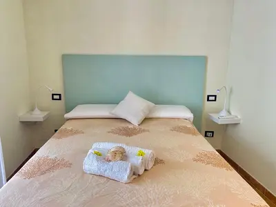 Letto o letti in una camera di Domu Su Neulaghe