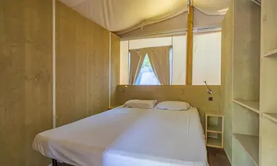 Letto o letti in una camera di Camping Village S'Ena Arrubia