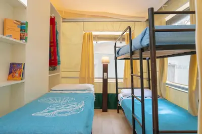 Letto o letti in una camera di Camping Village S'Ena Arrubia