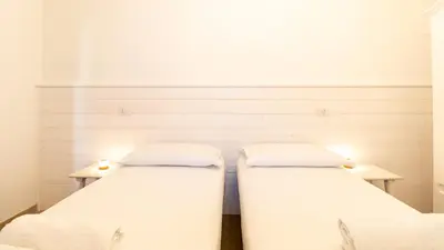 Letto o letti in una camera di Funtan'House-Hidden Gem