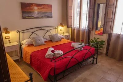 Letto o letti in una camera di B&B Città Regia