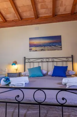 Letto o letti in una camera di B&B Città Regia