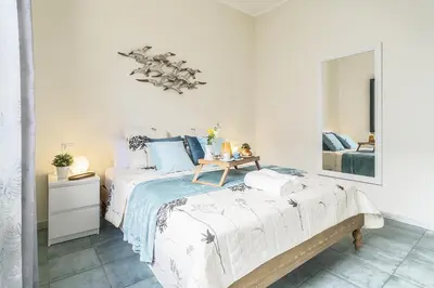 Letto o letti in una camera di Fiore Dell'Onda