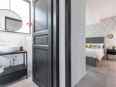 Letto o letti in una camera di Repubblica appartamento design con 2 camere letto