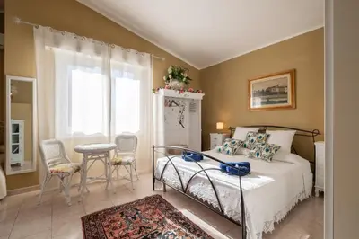 Letto o letti in una camera di Elegante Villa Lu' centro Città a 10 minuti dal mare