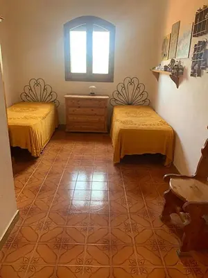 Letto o letti in una camera di Villa Gioia