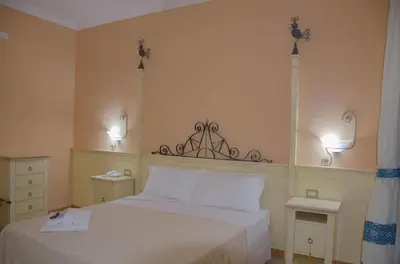 Letto o letti in una camera di LVG Hotel Collection - La Rosa dei Venti