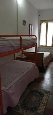 Letto o letti in una camera di Borgo Ingurtosu