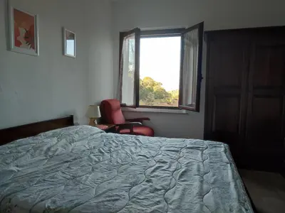Letto o letti in una camera di Borgo Ingurtosu