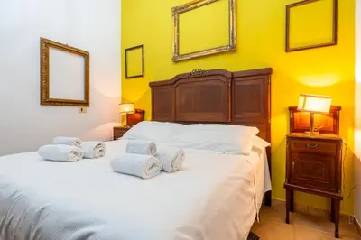 Letto o letti in una camera di Oasi Urbana con Terrazza e Vista