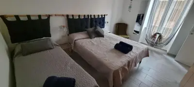 Letto o letti in una camera di Casa Noemi