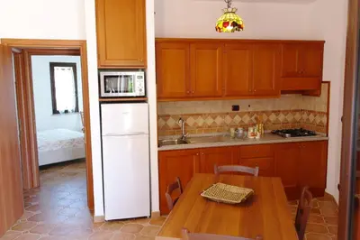 Cucina o angolo cottura di Bari Sardo Le More Suite 2