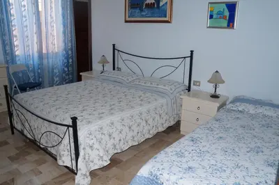 Letto o letti in una camera di Il Fenicottero Elmas