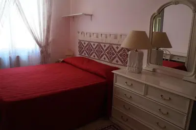 Letto o letti in una camera di Il Fenicottero Elmas