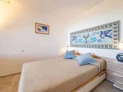 Letto o letti in una camera di Villa Arcobaleno sul mare