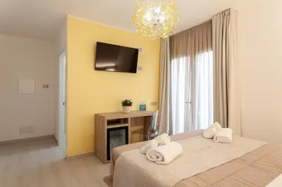 Letto o letti in una camera di Glorian Hotel