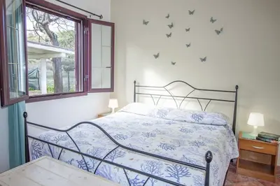 Letto o letti in una camera di Su Tuvulu 1