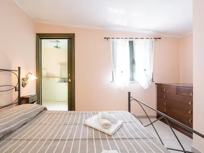 Letto o letti in una camera di Casa Angy
