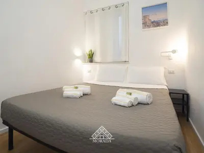 Letto o letti in una camera di Giardini 19 - MORADA