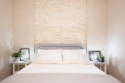 Letto o letti in una camera di OIKOS APARTMENT CAGLIARI