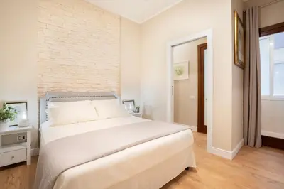 Letto o letti in una camera di OIKOS APARTMENT CAGLIARI