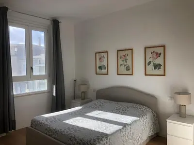 Letto o letti in una camera di Cadorna Attico San Benedetto