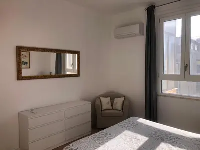 Letto o letti in una camera di Cadorna Attico San Benedetto