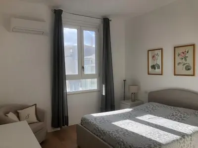 Letto o letti in una camera di Cadorna Attico San Benedetto