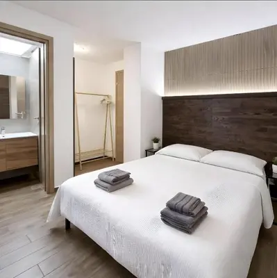 Letto o letti in una camera di TERA Cagliari