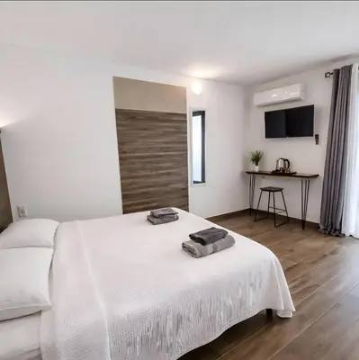 Letto o letti in una camera di TERA Cagliari