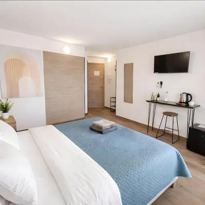 Letto o letti in una camera di TERA Cagliari