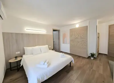 Letto o letti in una camera di TERA Cagliari