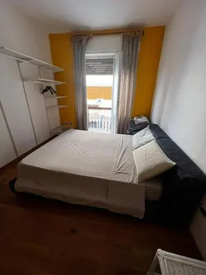 Letto o letti in una camera di appartamento sulle scalette