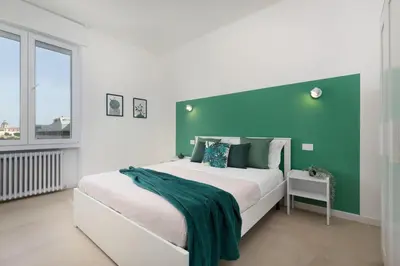 Letto o letti in una camera di Sve Suites Cagliari