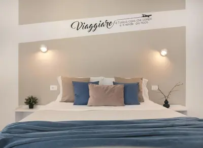 Letto o letti in una camera di Sve Suites Cagliari