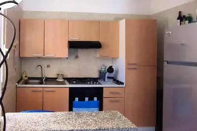 Cucina o angolo cottura di Villa Susy Solanas -IUN R5389