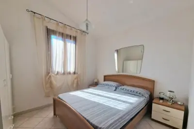 Letto o letti in una camera di Villa Susy Solanas -IUN R5389