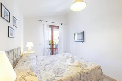 Letto o letti in una camera di Casa Calasetta sul porto