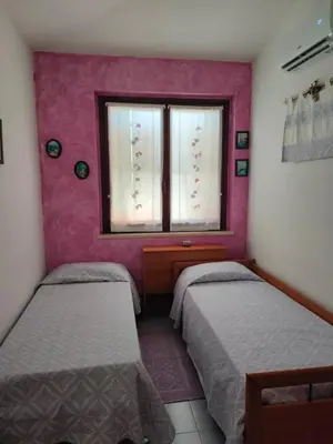 Letto o letti in una camera di Casa Vacanze I Borghi