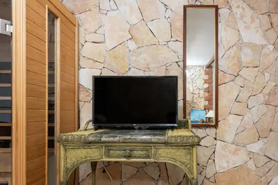 TV o dispositivi per l'intrattenimento presso GuestHost - Stunning Villa Paola with Swimming Pool & Terrace!