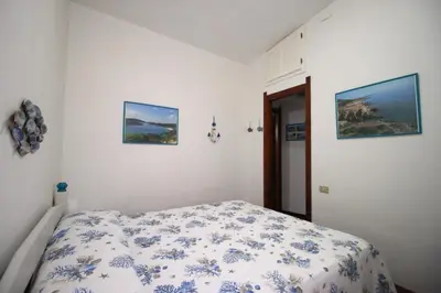 Letto o letti in una camera di Easy Flat Sardinia Sky Blue Home (Pinus Village)