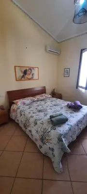 Letto o letti in una camera di Zurrundeddu House
