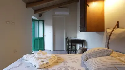 Letto o letti in una camera di Andala agriturismo esperienziale
