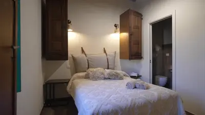 Letto o letti in una camera di Andala agriturismo esperienziale