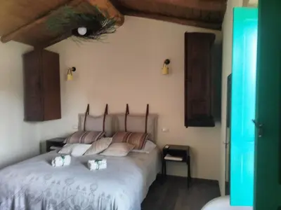 Letto o letti in una camera di Andala agriturismo esperienziale
