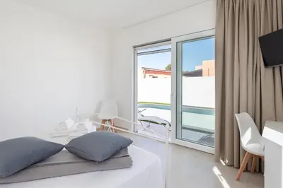 Letto o letti in una camera di Villa Greca Holiday Rooms