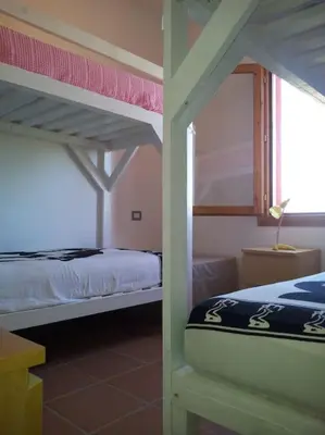 Letto o letti in una camera di Lara Home Via Colombo 152