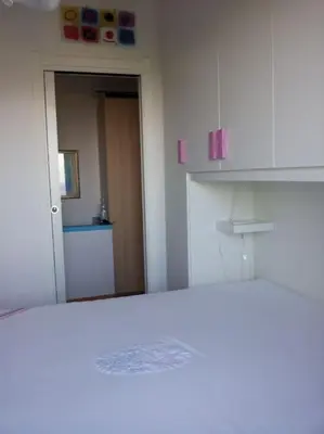 Letto o letti in una camera di Lara Home Via Colombo 152