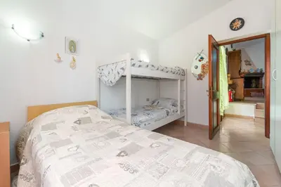 Letto o letti in una camera di Casa Vacanze a pochi passi dal mare , Sant'Antioco